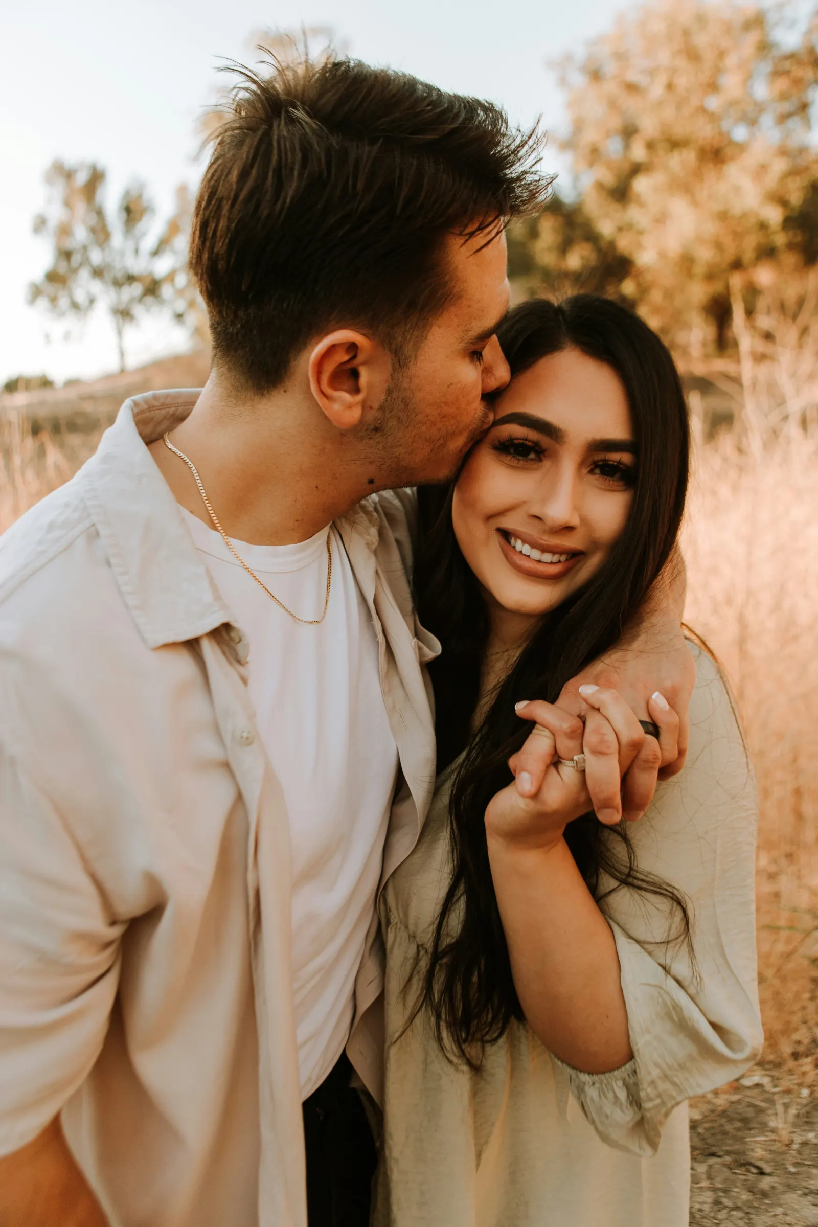 Couple embracing at sunset
